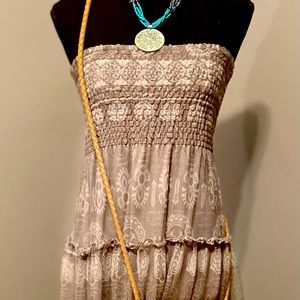 Boho strapless skirt paired with leather crossbody bag and beaded necklace
